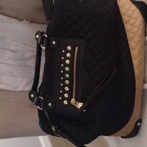 Beautiful Steve Madden tote bag. Great condition, but missing a stud.
